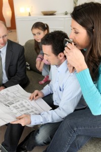 A family reviewing plans for redistributing the estate